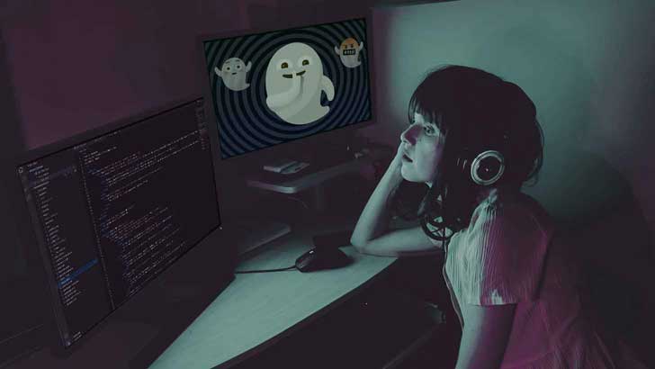 Photo illustration of a woman staring at a monitor filled with code. On another monitor, a series of ghost emojis appear against a vertigo-inducing spiral background.